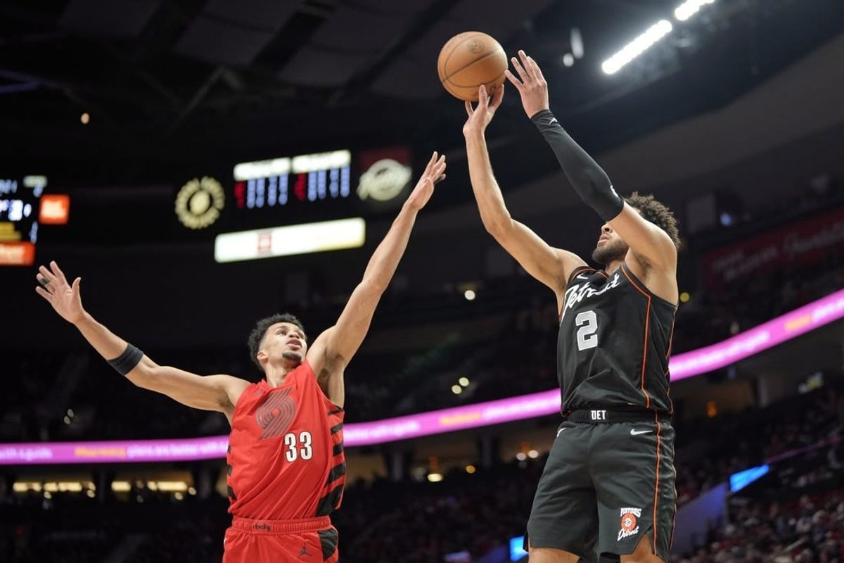 Feb 8, 2024; Portland, Oregon, USA; Detroit Pistons point guard Cade Cunningham (2) shoots the ball over Portland Trail Blazers forward Toumani Camara (33) during the first half at Moda Center.