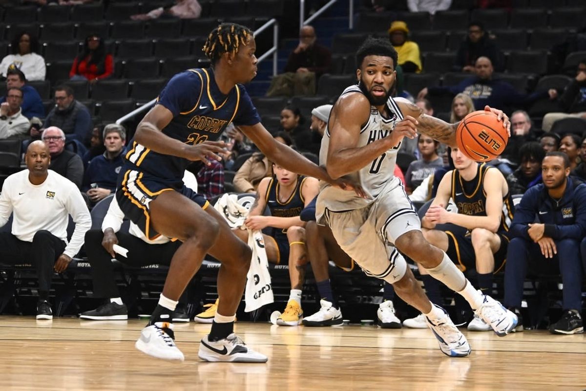 Dec 12, 2023; Washington, District of Columbia, USA; Georgetown Hoyas guard Dontrez Styles (0) dribbles past Coppin State Eagles forward Toto Fagbenle (20) during the first half at Capital One Arena.