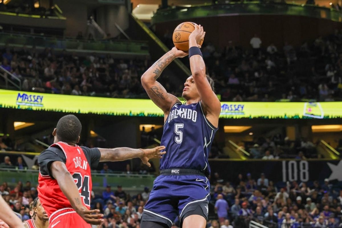 Apr 7, 2024; Orlando, Florida, USA; Orlando Magic forward Paolo Banchero (5) shoots the ball during the second quarter against the Chicago Bulls at KIA Center.