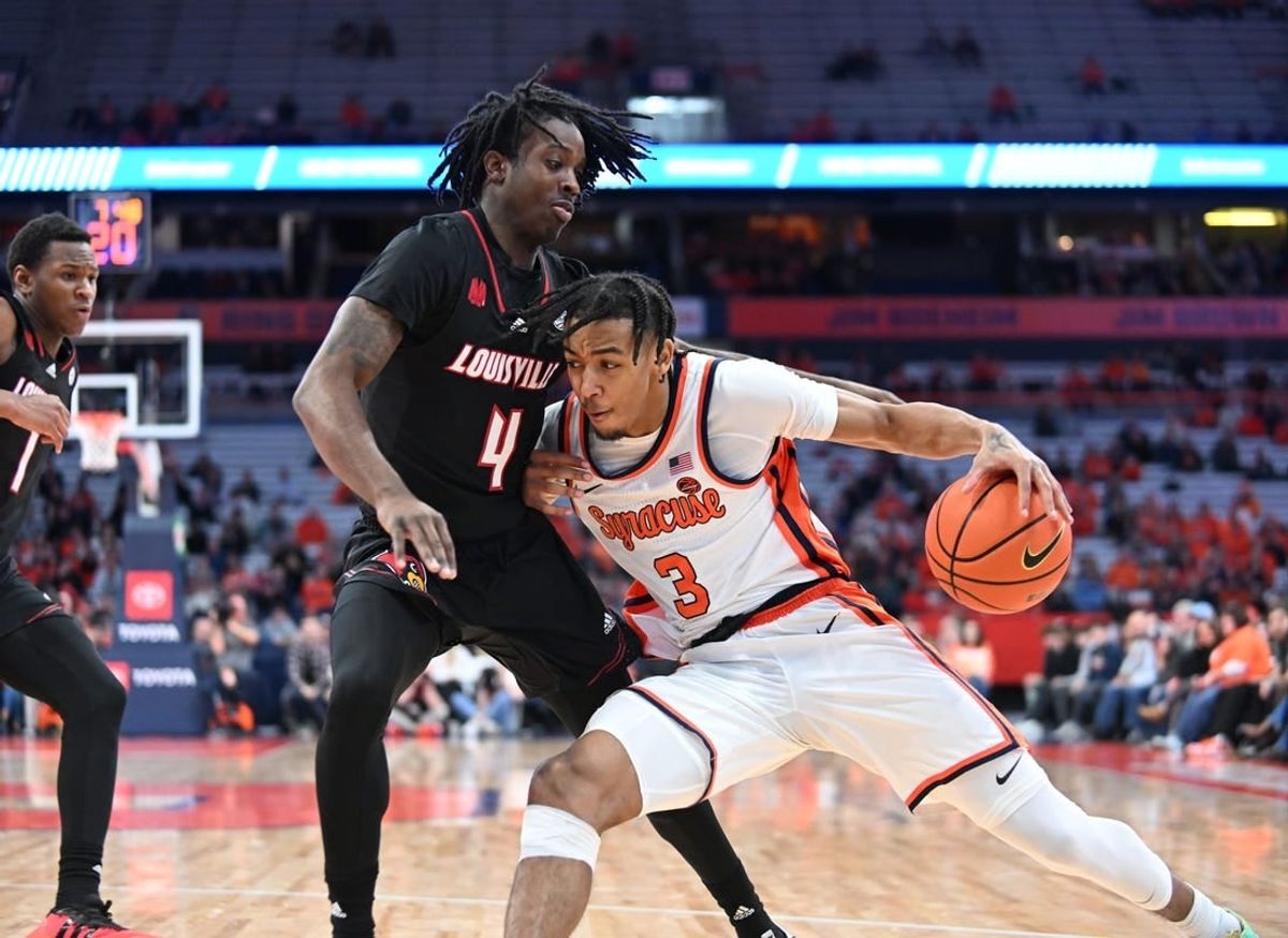 Feb 7, 2024; Syracuse, New York, USA; Syracuse Orange guard Judah Mintz (3) posts up against Louisville Cardinals guard Ty-Laur Johnson (4) in the second half at the JMA Wireless Dome.