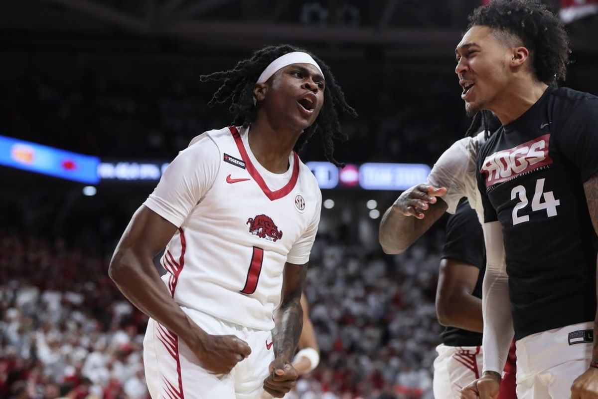 Jan 6, 2024; Fayetteville, Arkansas, USA; Arkansas Razorbacks guard Keyon Menifield Jr (1) celebrates after making a three point shot in the first half against the Auburn Tigers at Bud Walton Arena.
