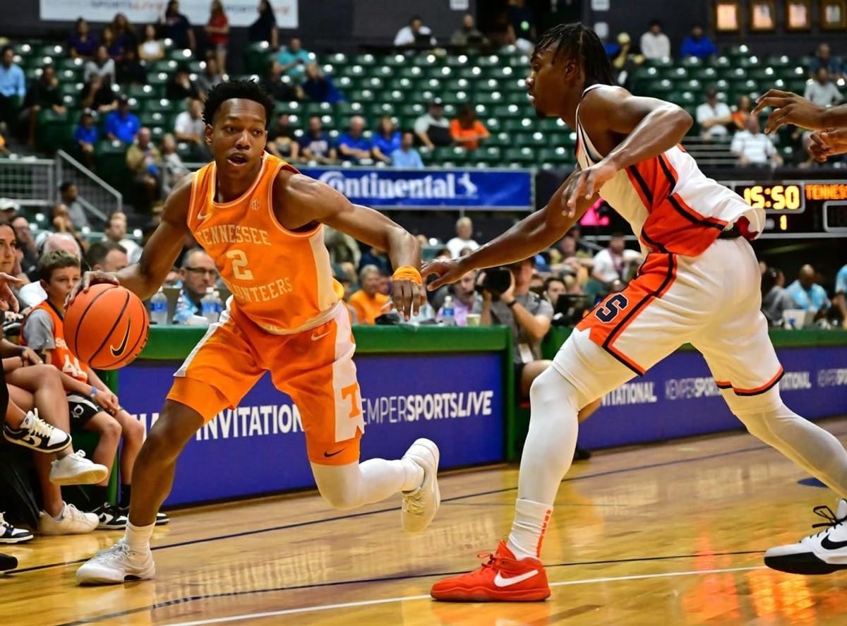 Nov 20, 2023; Honolulu, Hawaii, USA;  Tennessee Volunteers guard Jordan Gainey (2) drives the ball around Syracuse Orange guard JJ Starling (2) during the first period at SimpliFi Arena at Stan Sheriff Center.