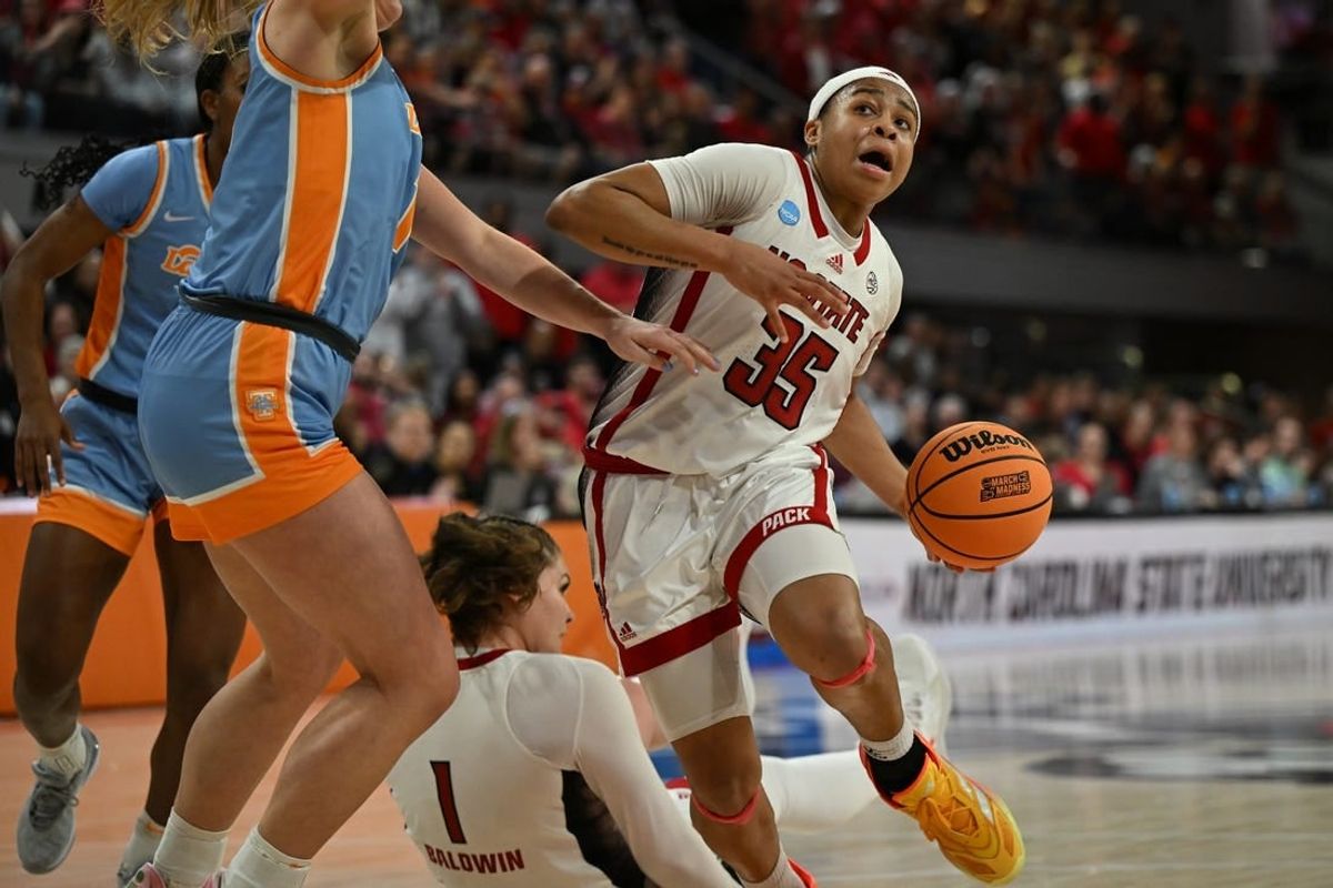 Mar 25, 2024; Raleigh, North Carolina, USA; NC State Wolfpack guard Zoe Brooks (35) drives past Tennessee Lady Vols guard Sara Puckett (1) in the second round of the 2024 NCAA Women's Tournament at James T. Valvano Arena at William Neal Reynolds.