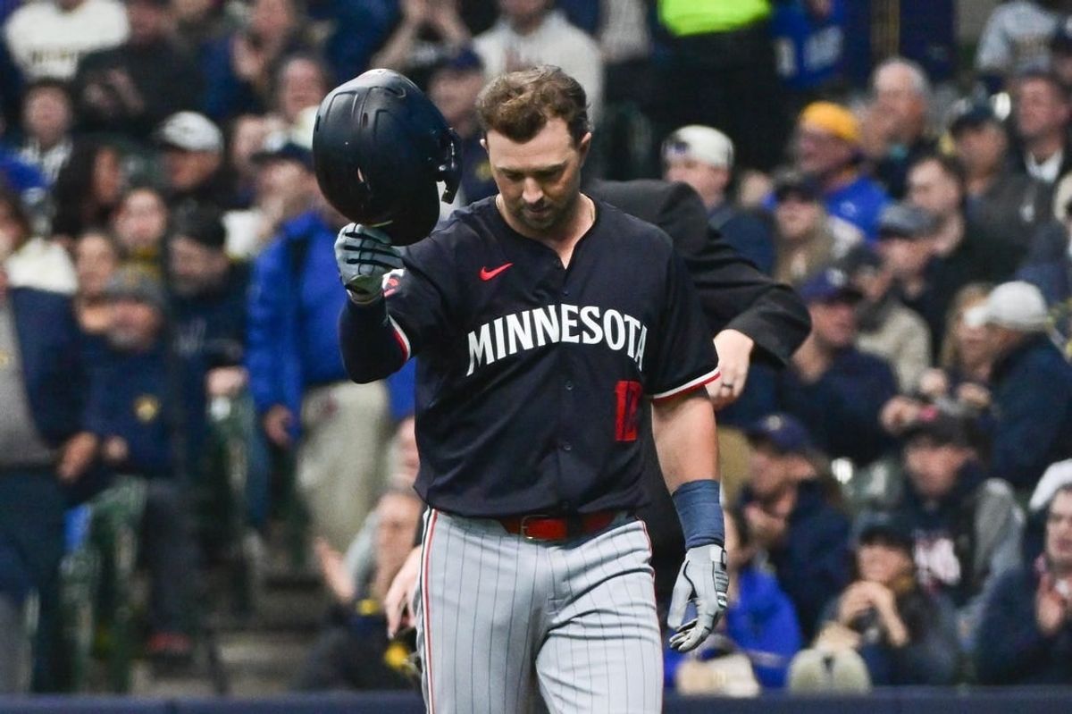 Apr 2, 2024; Milwaukee, Wisconsin, USA;  Minnesota Twins pinch hitter Kyle Farmer (12) reacts after striking out in the seventh inning against the Milwaukee Brewers at American Family Field.