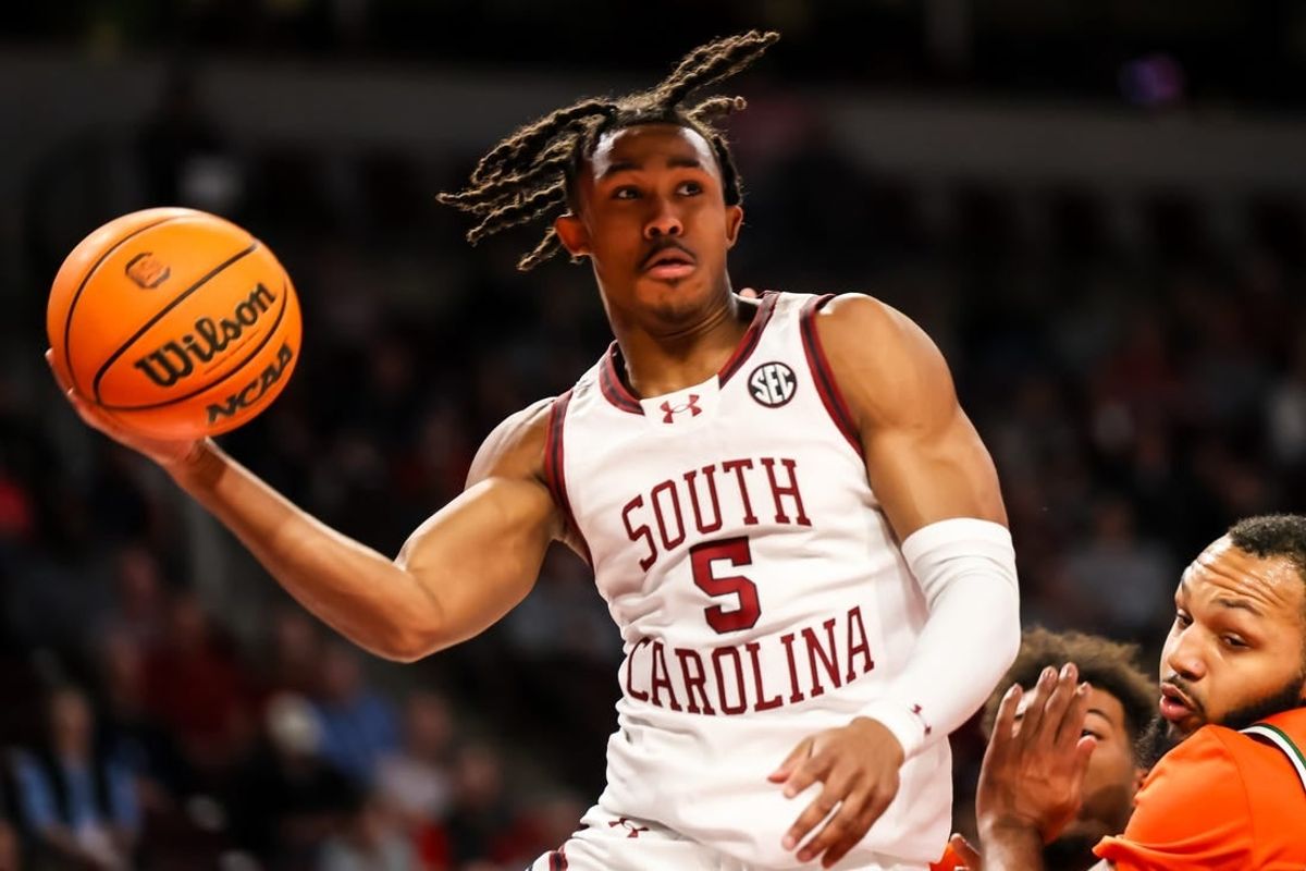 Dec 30, 2023; Columbia, South Carolina, USA; South Carolina Gamecocks guard Meechie Johnson (5) passes against the Florida A&M Rattlers in the first quarter at Colonial Life Arena.