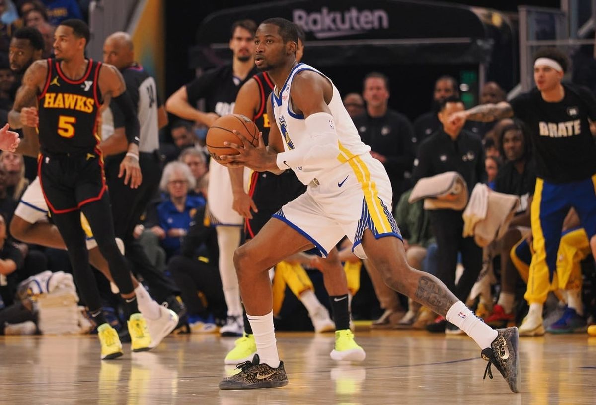 Jan 24, 2024; San Francisco, California, USA; Golden State Warriors forward Jonathan Kuminga (00) controls the ball against the Atlanta Hawks during the first quarter at Chase Center.