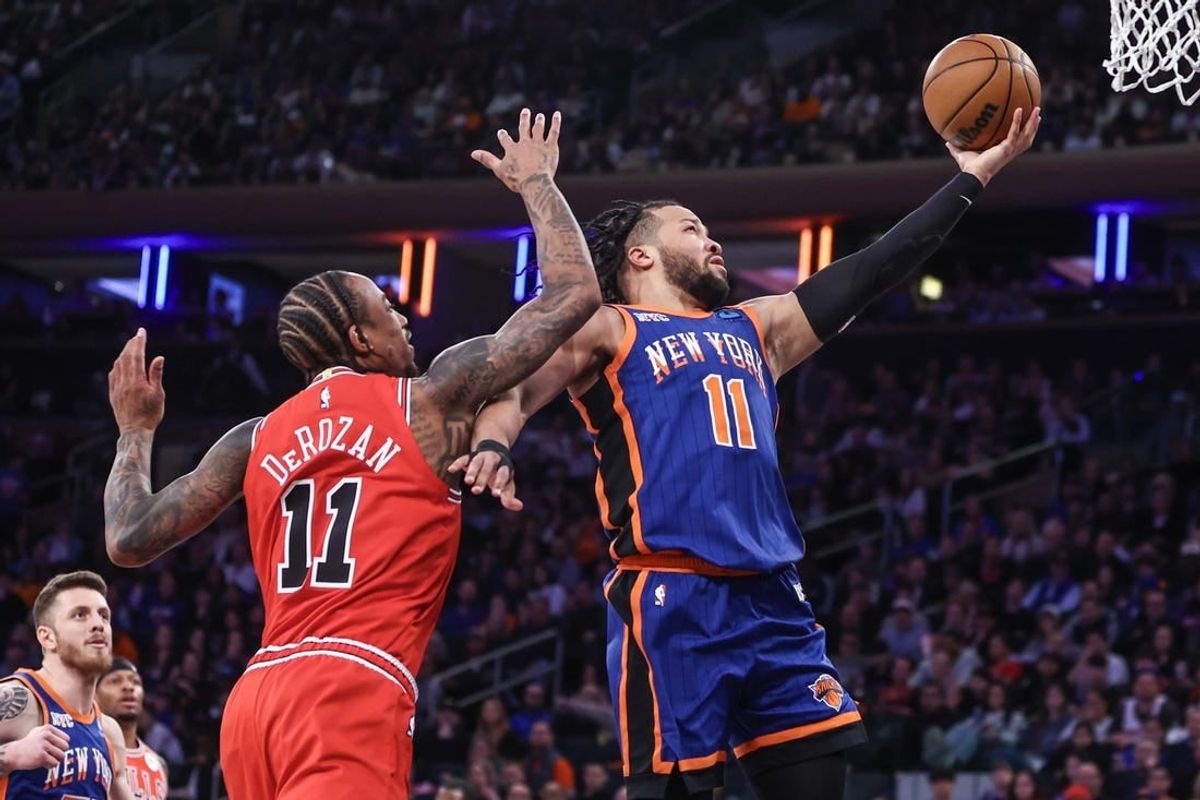 Apr 14, 2024; New York, New York, USA;  New York Knicks guard Jalen Brunson (11) drives past Chicago Bulls forward DeMar DeRozan (11) in the second quarter at Madison Square Garden.