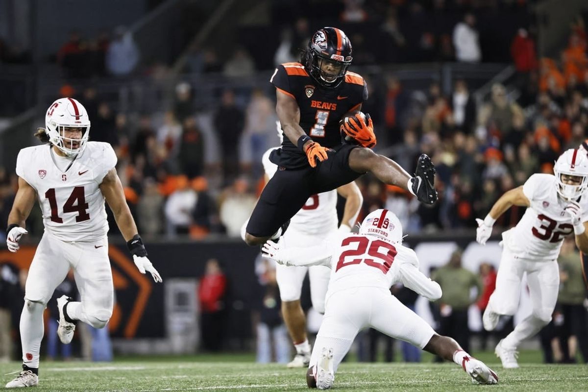 Nov 11, 2023; Corvallis, Oregon, USA; Oregon State Beavers running back Deshaun Fenwick (1) jumps over Stanford Cardinal corner back Terian Williams (29) during the second half at Reser Stadium.