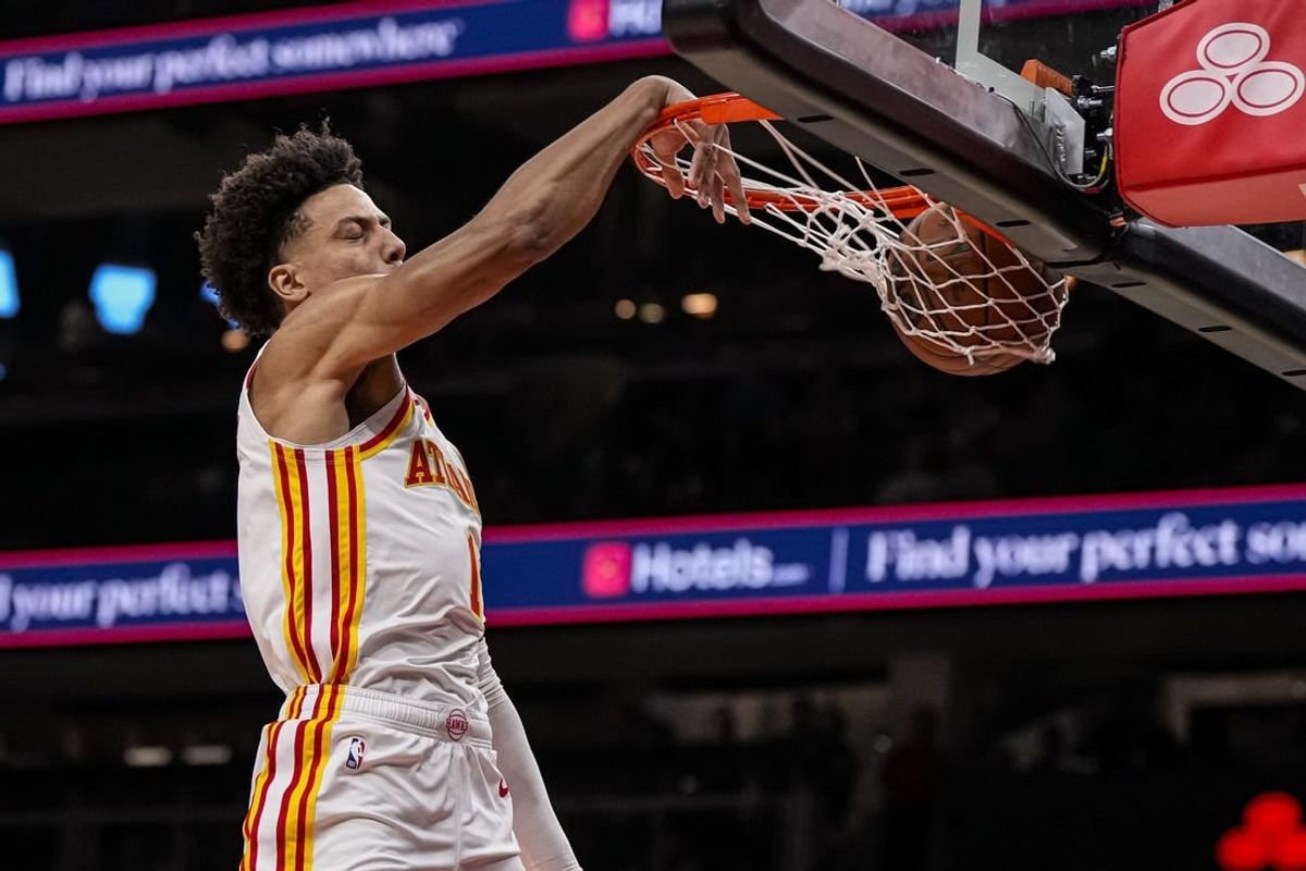 Apr 3, 2024; Atlanta, Georgia, USA; Atlanta Hawks forward Jalen Johnson (1) dunks the ball against the Detroit Pistons during the first half at State Farm Arena.