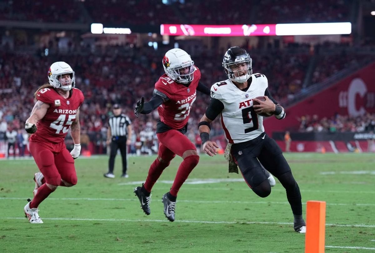 Nov 12, 2023; Glendale, Arizona, USA; Atlanta Falcons quarterback Desmond Ridder (9) runs for a touchdown against the Arizona Cardinals during the second half at State Farm Stadium.