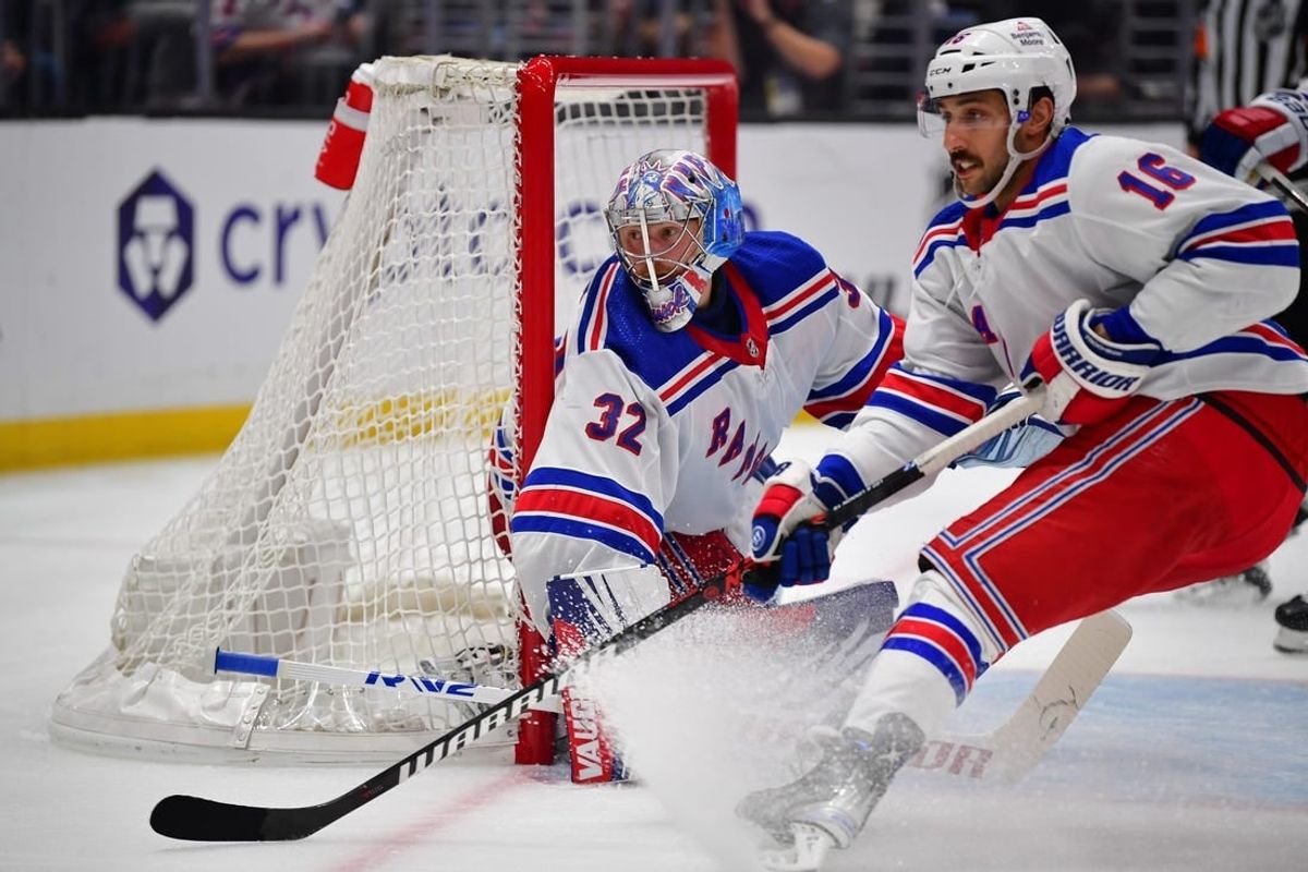 Jan 20, 2024; Los Angeles, California, USA; New York Rangers center Vincent Trocheck (16) helps goaltender Jonathan Quick (32) defend the goal against the Los Angeles Kings durng the second period at Crypto.com Arena.
