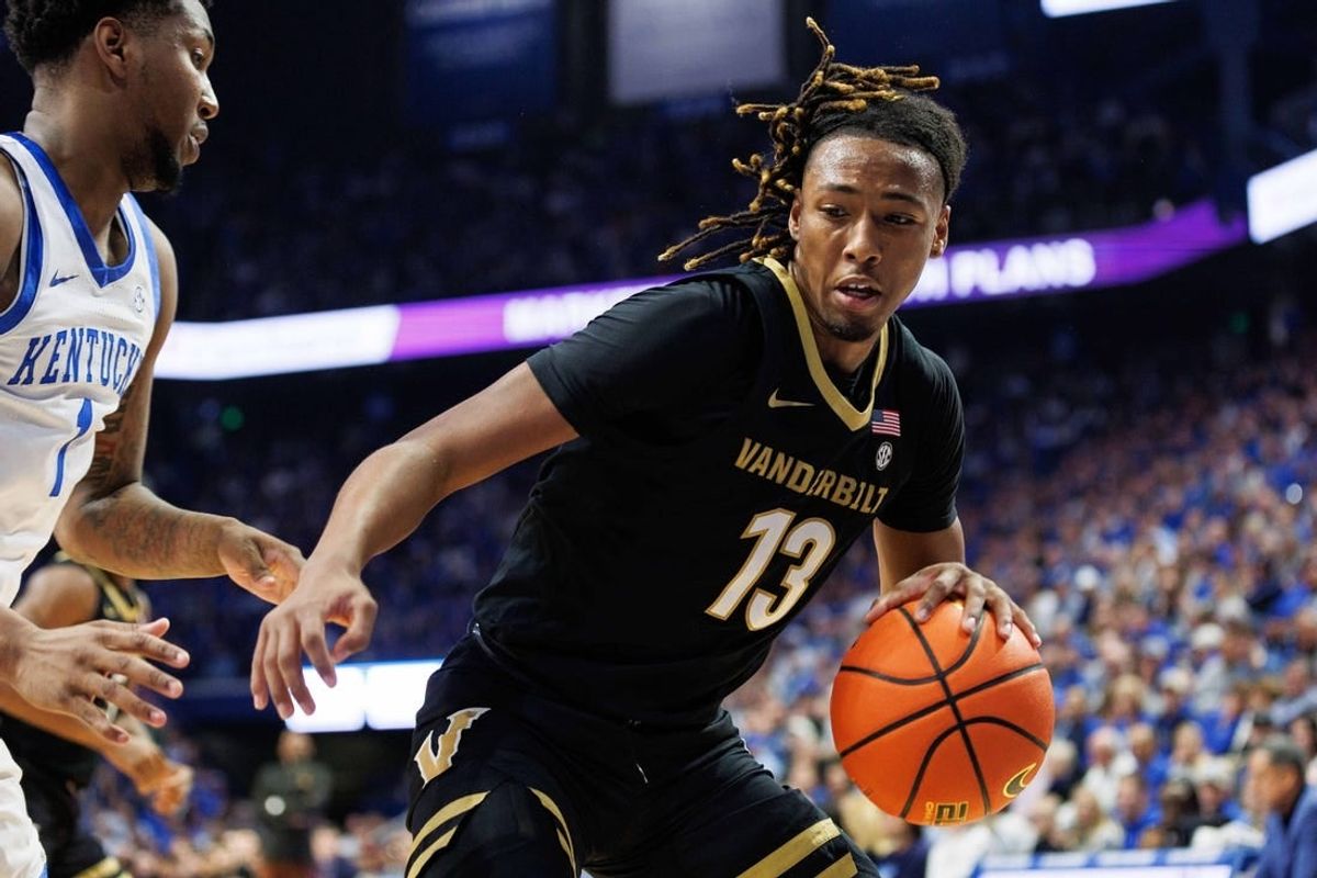 Mar 6, 2024; Lexington, Kentucky, USA; Vanderbilt Commodores guard Malik Presley (13) drives to the basket during the first half against the Kentucky Wildcats at Rupp Arena at Central Bank Center.