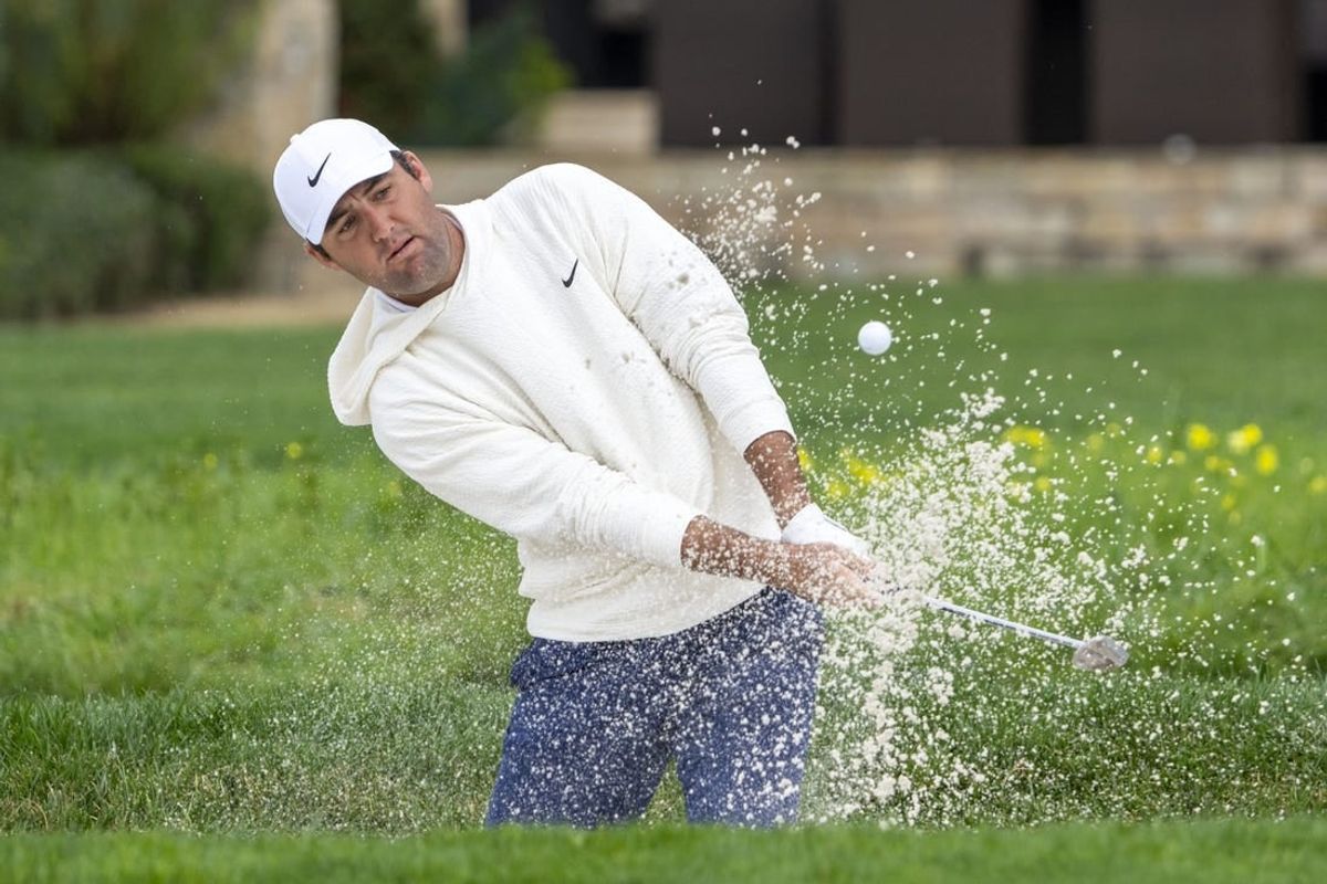 February 3, 2024; Pebble Beach, California, USA; Scottie Scheffler hits his bunker shot on the second hole during the third round of the AT&T Pebble Beach Pro-Am golf tournament at Pebble Beach Golf Links.