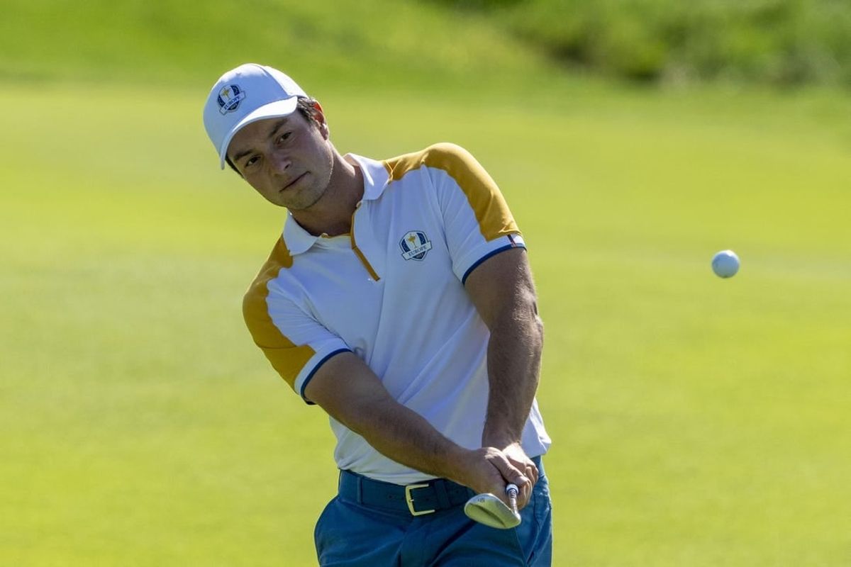 September 26, 2023; Rome, ITALY; Team Europe golfer Viktor Hovland hits his chip shot on the second hole during a practice round of the Ryder Cup golf competition at Marco Simone Golf and Country Club.