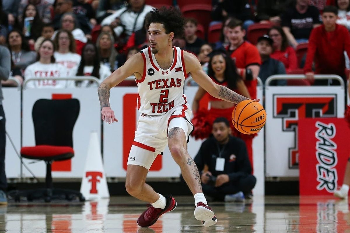 Dec 21, 2023; Lubbock, Texas, USA;  Texas Tech Red Raiders guard Pop Isaacs (2) dribbles the ball against the Texas-Arlington Mavericks in the first half at United Supermarkets Arena.