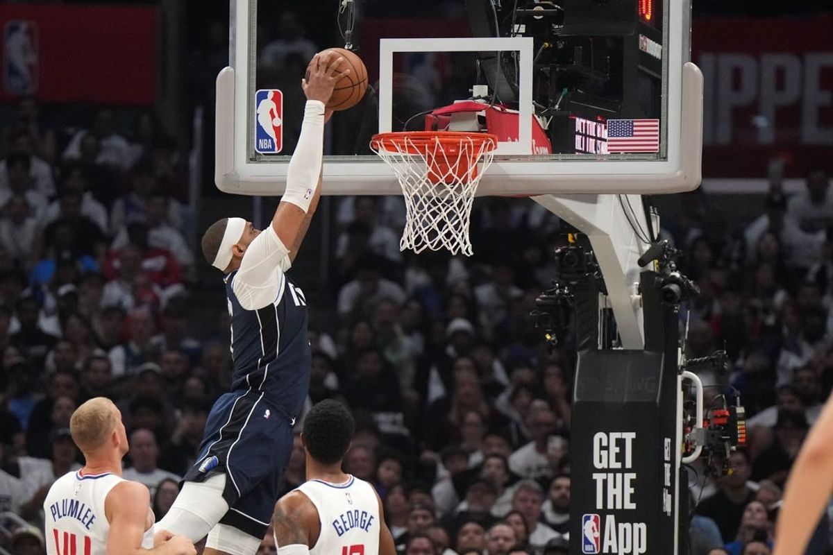 May 1, 2024; Los Angeles, California, USA; Dallas Mavericks center Daniel Gafford (21) dunks the ball against the LA Clippers in the first half during game five of the first round for the 2024 NBA playoffs at Crypto.com Arena.