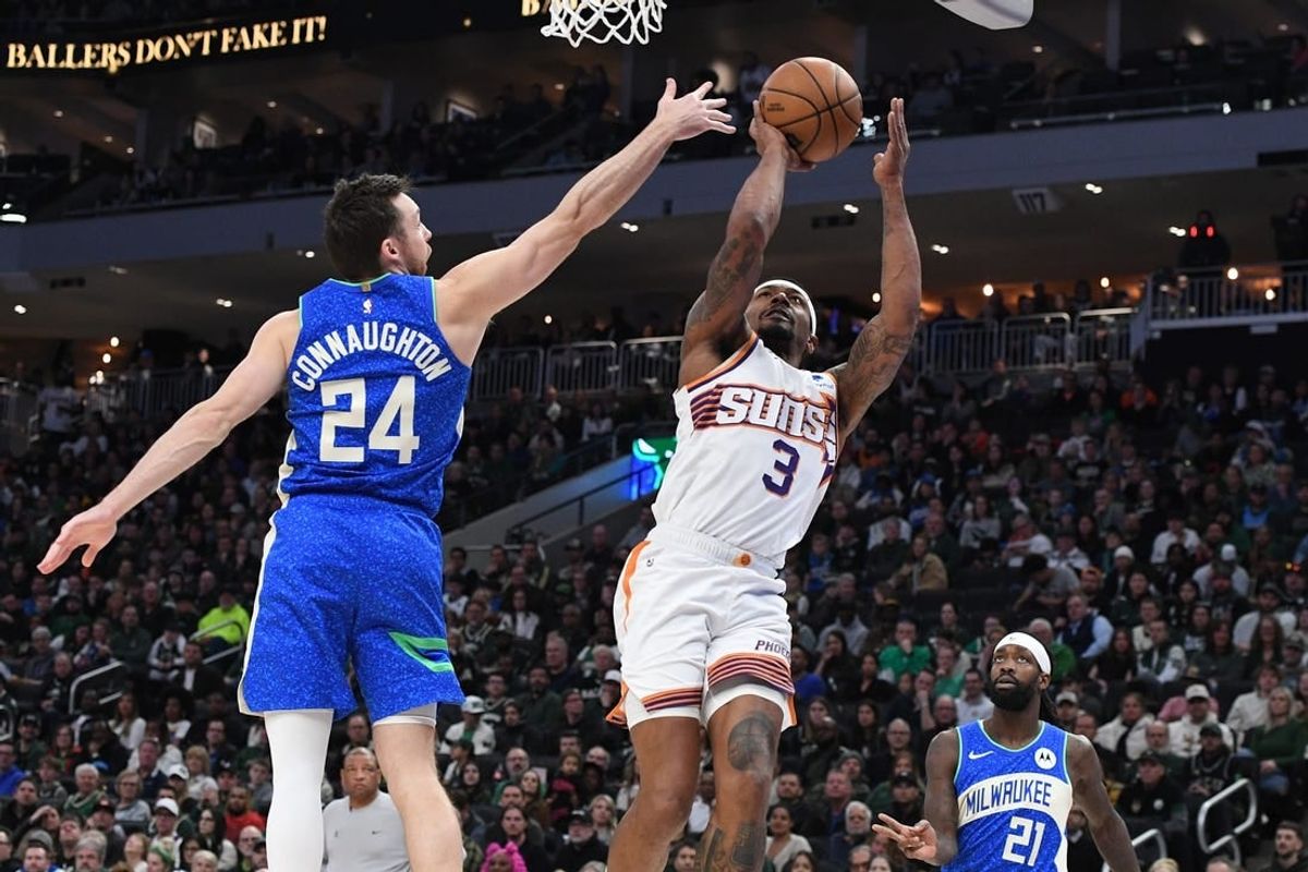 Mar 17, 2024; Milwaukee, Wisconsin, USA; Phoenix Suns guard Bradley Beal (3) drives to the basket against Milwaukee Bucks guard Pat Connaughton (24) in the second half at Fiserv Forum.