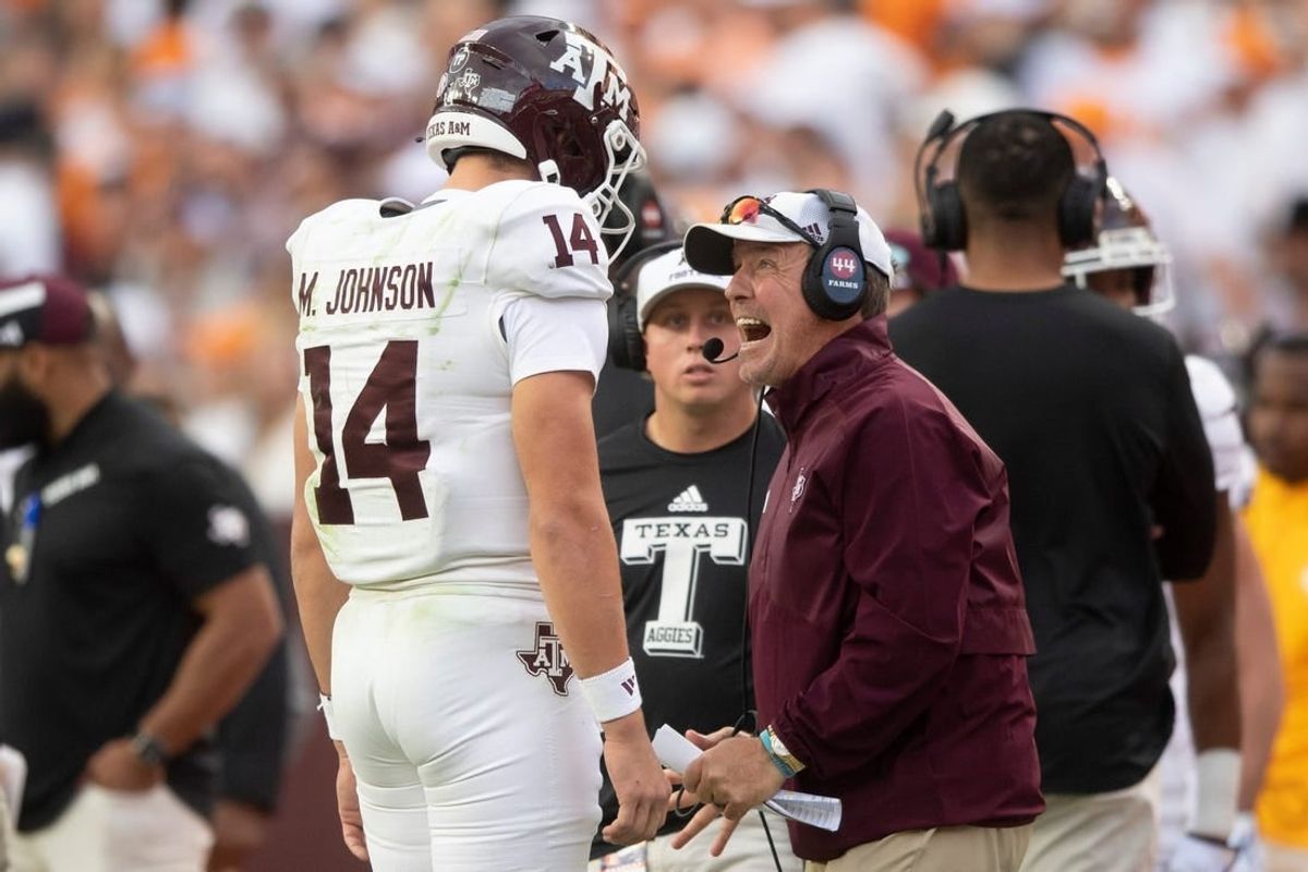 Oct 14, 2023; Knoxville, TN, USA; Texas A&M quarterback Max Johnson (14) talks with Texas A&M head coach Jimbo Fisher during a football game between Tennessee and Texas A&M at Neyland Stadium in Knoxville, Tenn., on Saturday, Oct. 14, 2023.