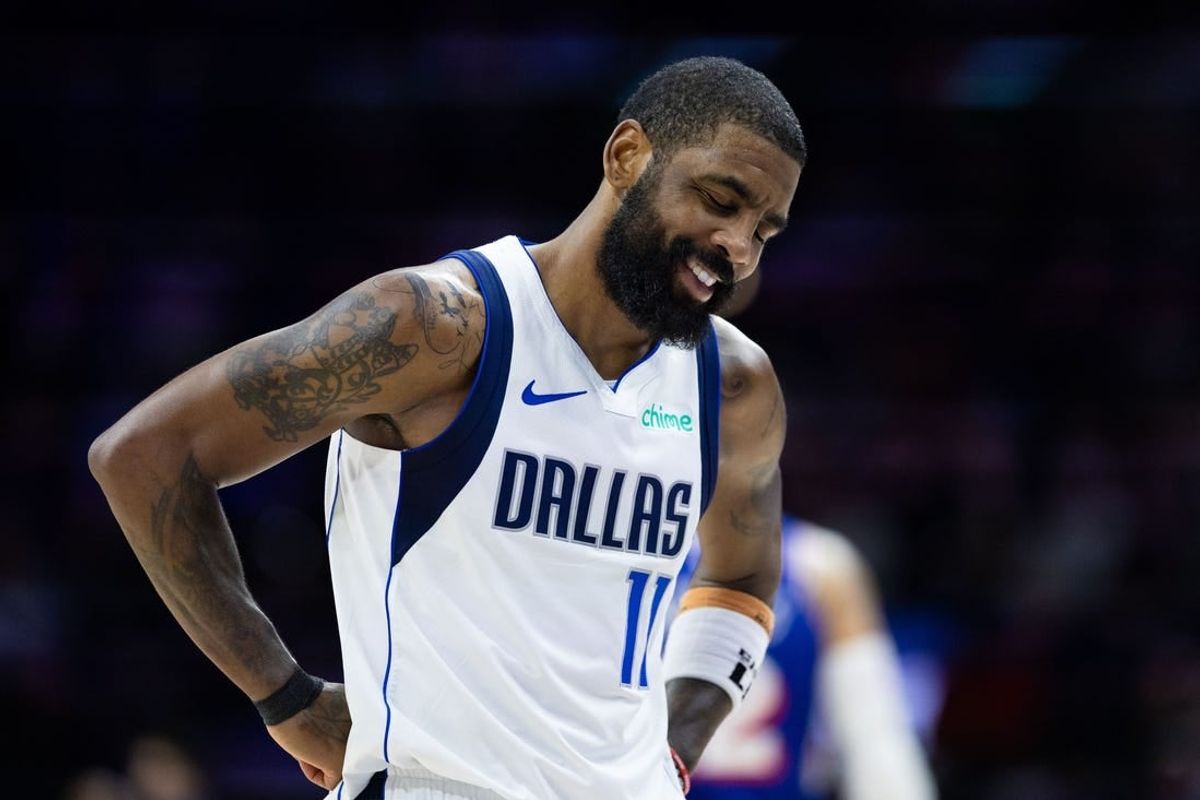 Feb 5, 2024; Philadelphia, Pennsylvania, USA; Dallas Mavericks guard Kyrie Irving (11) reacts after a foul call during the fourth quarter against the Philadelphia 76ers at Wells Fargo Center.