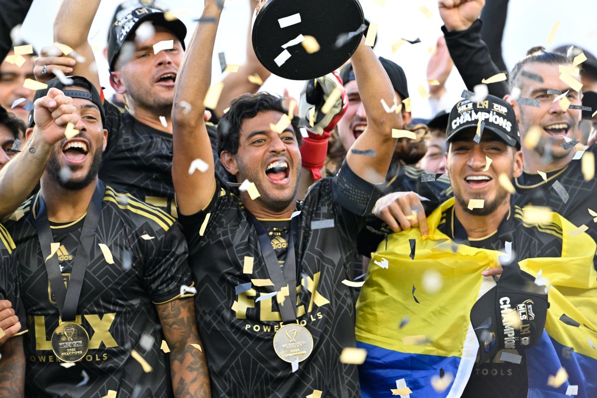 Carlos Vela of LAFC raises the MLS Cup