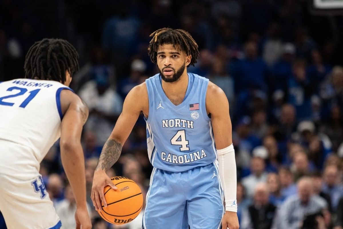 Dec 16, 2023; Atlanta, Georgia, USA North North Carolina Tar Heels guard RJ Davis (4) dribbles the ball against UCLA Bruins forward Evan Manjikian (21) during the second half at State Farm Arena.