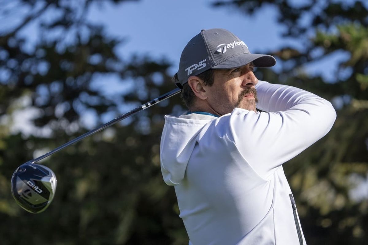 February 2, 2024; Pebble Beach, California, USA; New York Jets quarterback Aaron Rodgers hits his tee shot on the 16th hole during the second round of the AT&T Pebble Beach Pro-Am golf tournament at Pebble Beach Golf Links.