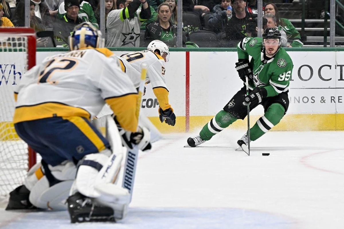 Jan 12, 2024; Dallas, Texas, USA; Nashville Predators goaltender Kevin Lankinen (32) faces a shot by Dallas Stars center Matt Duchene (95) during the second period at the American Airlines Center.