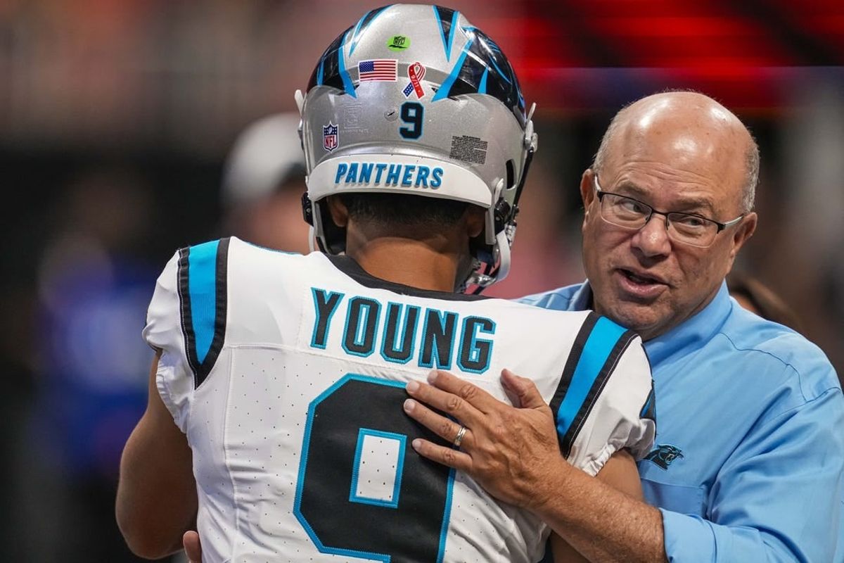 Sep 10, 2023; Atlanta, Georgia, USA; Carolina Panthers quarterback Bryce Young (9) hugs team owner David Tepper on the field prior to the game against the Atlanta Falcons at Mercedes-Benz Stadium.