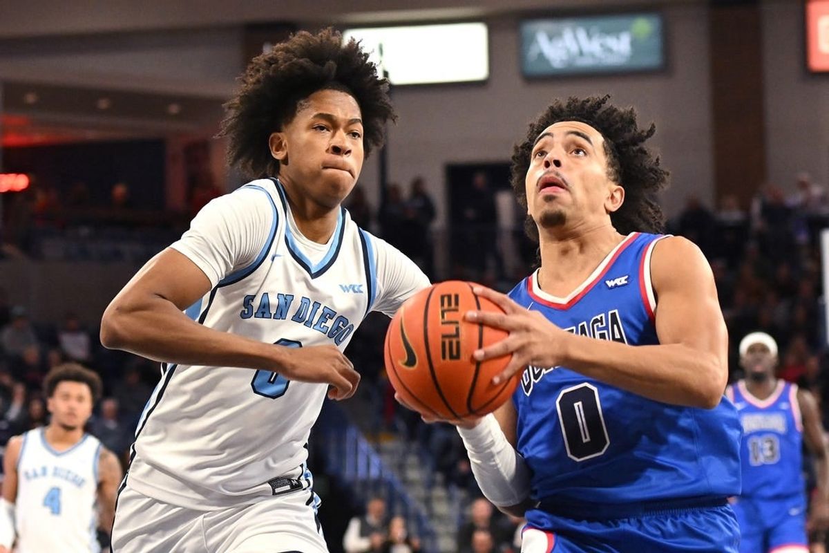 Jan 6, 2024; Spokane, Washington, USA; Gonzaga Bulldogs guard Ryan Nembhard (0) shoots the ball against San Diego Toreros guard Kevin Patton Jr. (0) in the second half at McCarthey Athletic Center. Gonzaga won 101-74.