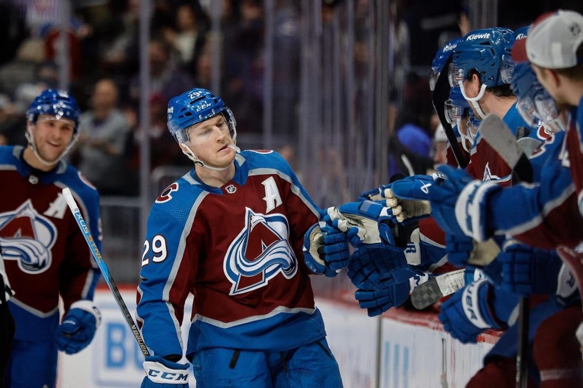 Dec 21, 2023; Denver, Colorado, USA; Colorado Avalanche center Nathan MacKinnon (29) celebrates with the bench after his fourth goal of the game against the Ottawa Senators at Ball Arena.