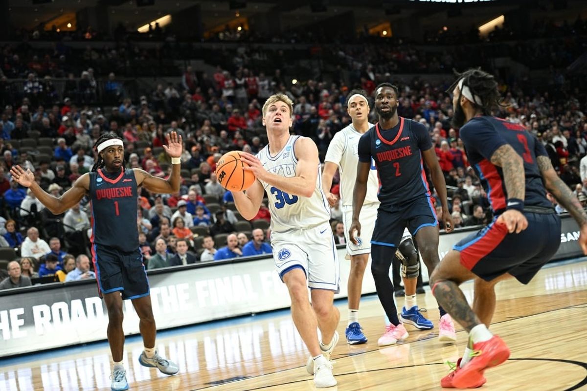 Mar 21, 2024; Omaha, NE, USA; Brigham Young Cougars guard Dallin Hall (30) drives against Duquesne Dukes guard Dae Dae Grant (3) in the second half during the first round of the NCAA Tournament at CHI Health Center Omaha.