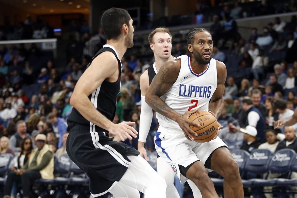Feb 23, 2024; Memphis, Tennessee, USA; Los Angeles Clippers forward Kawhi Leonard (2) drives to the basket as Memphis Grizzlies forward-center Santi Aldama (7) defends during the second half at FedExForum.