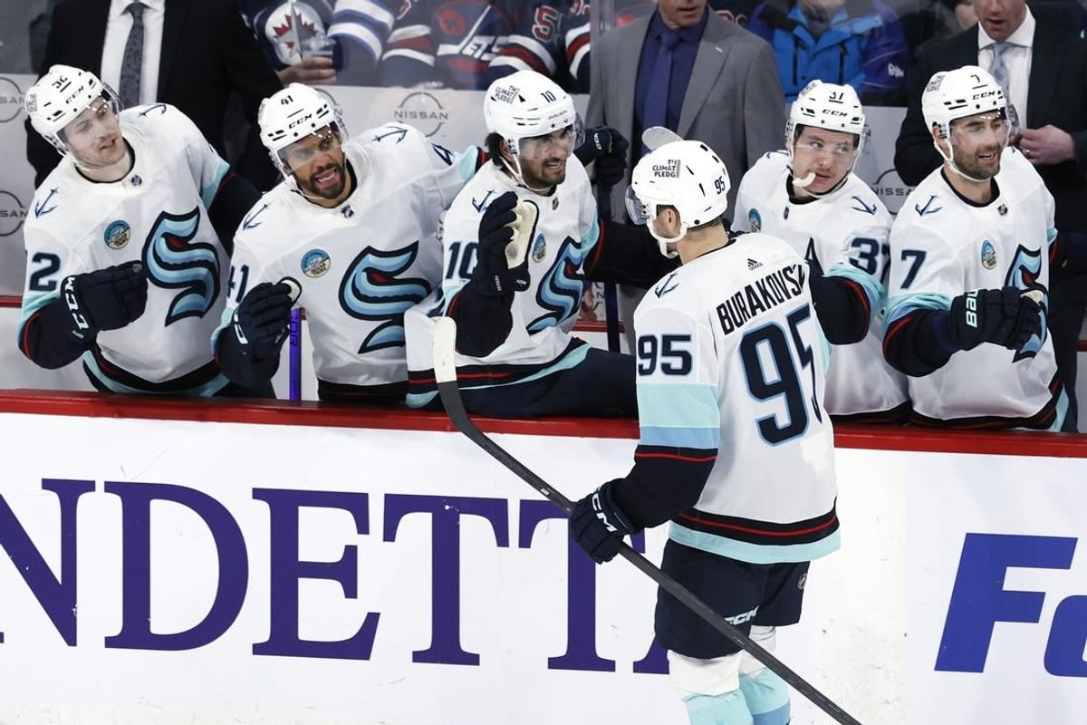Mar 5, 2024; Winnipeg, Manitoba, CAN; Seattle Kraken left wing Andre Burakovsky (95) celebrates his third period goal against the Winnipeg Jets at Canada Life Centre.