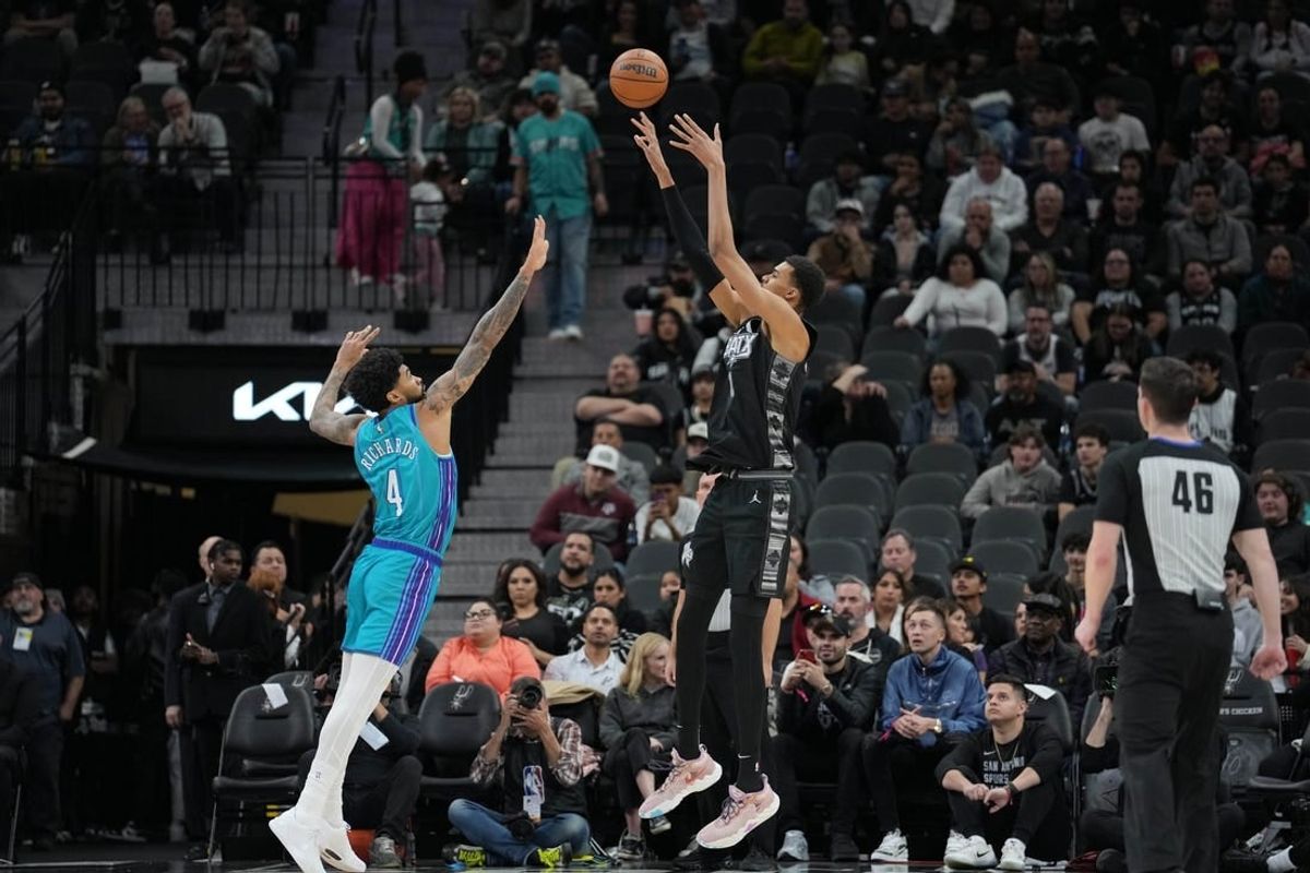 Jan 12, 2024; San Antonio, Texas, USA;  San Antonio Spurs center Victor Wembanyama (1) shoots over Charlotte Hornets center Nick Richards (4) in the first half at Frost Bank Center.
