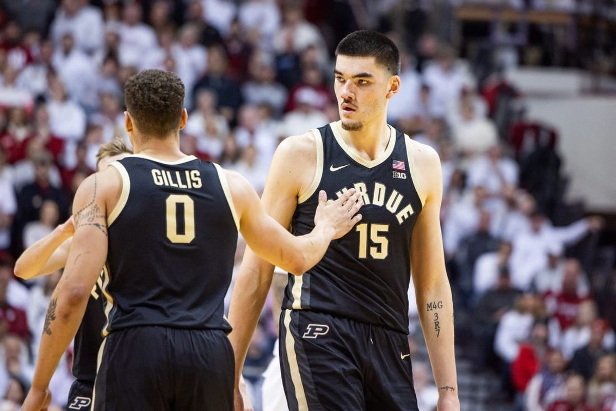 Jan 16, 2024; Bloomington, Indiana, USA; Purdue Boilermakers center Zach Edey (15) and forward Mason Gillis (0) celebrate a basket in the first half against the Indiana Hoosiers at Simon Skjodt Assembly Hall.