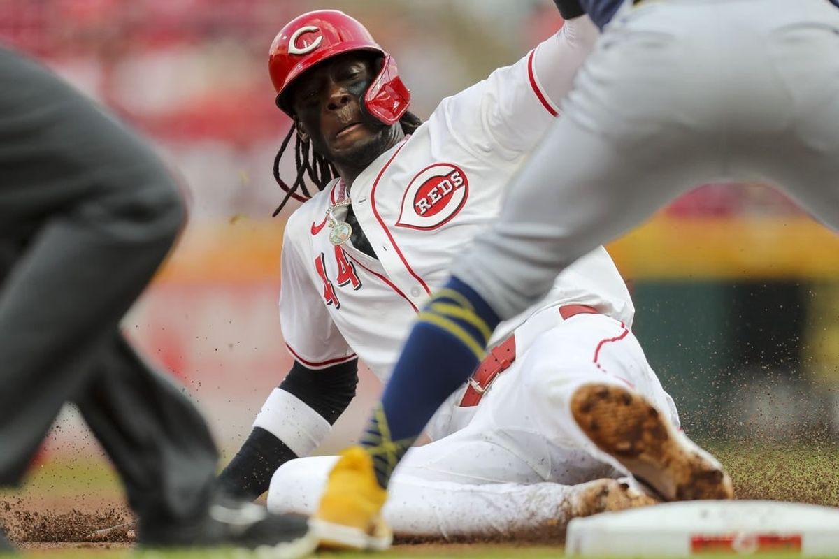 Apr 8, 2024; Cincinnati, Ohio, USA; Cincinnati Reds shortstop Elly De La Cruz (44) steals third in the second inning against the Milwaukee Brewers at Great American Ball Park.