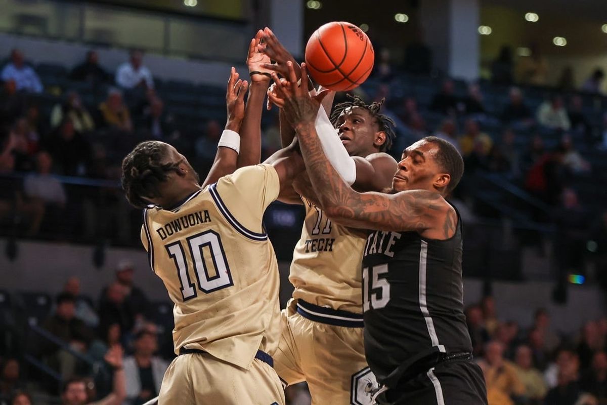 Nov 28, 2023; Atlanta, Georgia, USA; Georgia Tech Yellow Jackets forward Ebenezer Dowuona (10) and forward Baye Ndongo (11) reach for a rebound with Mississippi State Bulldogs forward Jimmy Bell Jr. (15) in the second half at McCamish Pavilion.