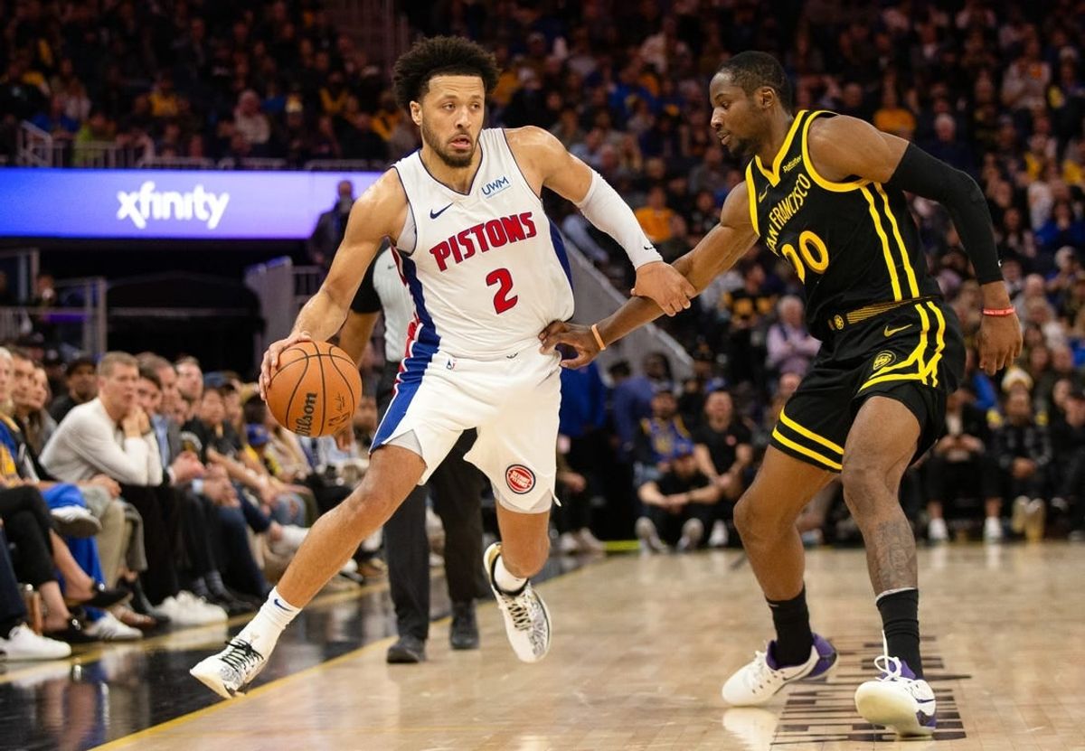 Jan 5, 2024; San Francisco, California, USA; Detroit Pistons guard Cade Cunningham (2) drives around Golden State Warriors guard Stephen Curry (30) during the fourth quarter at Chase Center.