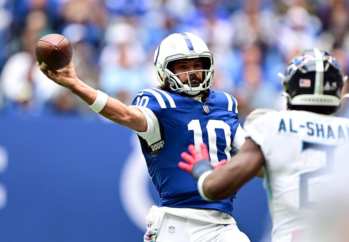 Oct 8, 2023; Indianapolis, Indiana, USA; Indianapolis Colts quarterback Gardner Minshew (10) throws a pass over Tennessee Titans linebacker Azeez Al-Shaair (2) during the second half at Lucas Oil Stadium.