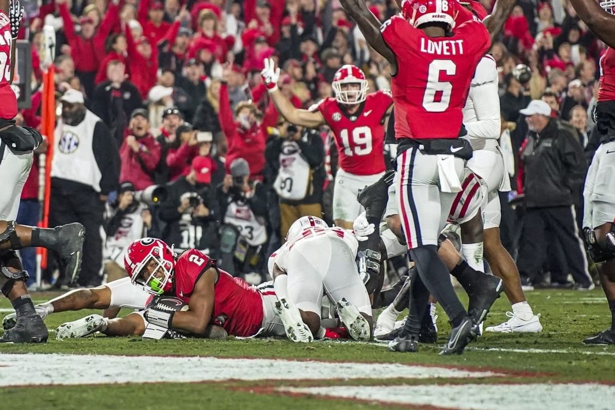 Nov 11, 2023; Athens, Georgia, USA; Georgia Bulldogs running back Kendall Milton (2) scores a touchdown against the Mississippi Rebels during the first half at Sanford Stadium.