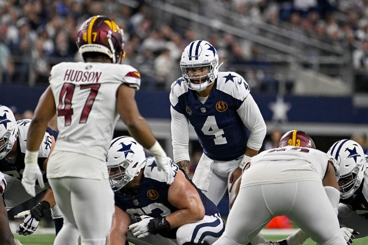 Nov 23, 2023; Arlington, Texas, USA; Dallas Cowboys quarterback Dak Prescott (4) in action during the game between the Dallas Cowboys and the Washington Commanders at AT&T Stadium.