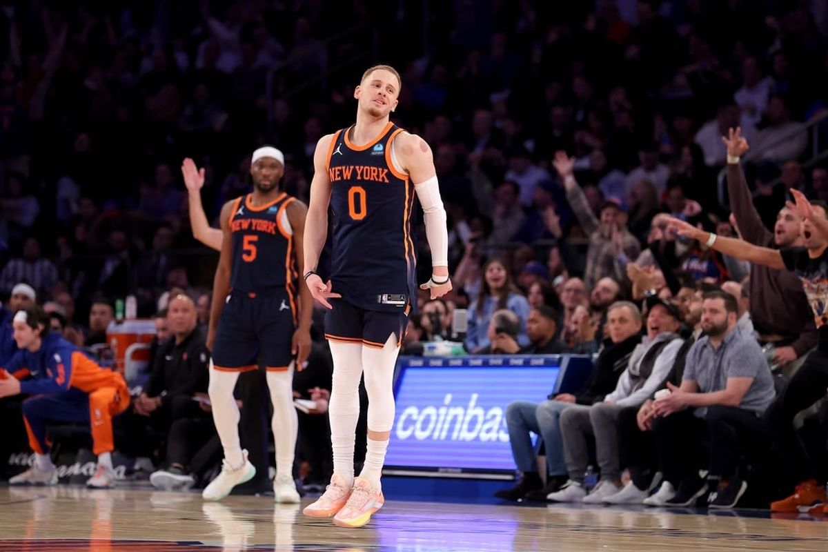 Jan 30, 2024; New York, New York, USA; New York Knicks guard Donte DiVincenzo (0) celebrates his three point shot against the Utah Jazz during the third quarter at Madison Square Garden.