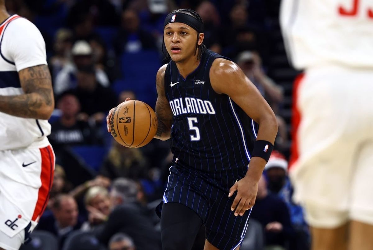 Nov 29, 2023; Orlando, Florida, USA; Orlando Magic forward Paolo Banchero (5) drives to the basket against the Washington Wizards during the first quarter at Amway Center.