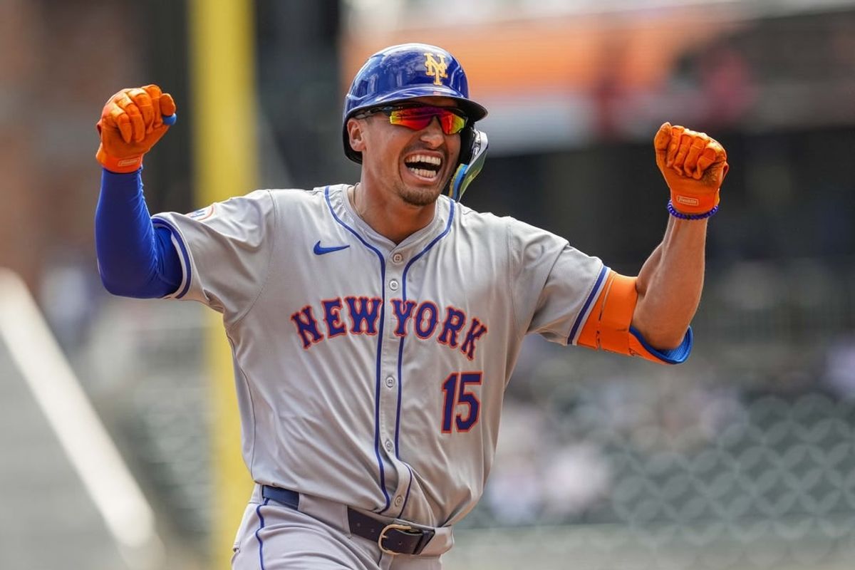 Apr 11, 2024; Cumberland, Georgia, USA; New York Mets pinch hitter Tyrone Taylor (15) reacts after hitting a grand slam home run against the Atlanta Braves during the ninth inning at Truist Park.
