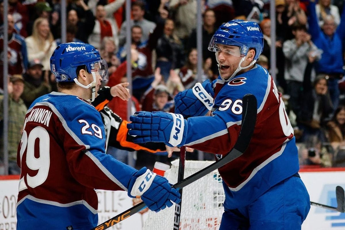 Dec 17, 2023; Denver, Colorado, USA; Colorado Avalanche center Nathan MacKinnon (29) celebrates his goal with right wing Mikko Rantanen (96) in the second period against the San Jose Sharks at Ball Arena.