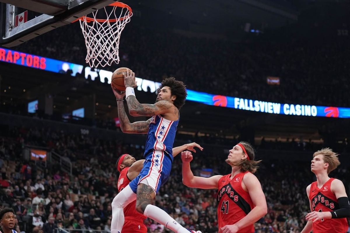 Mar 31, 2024; Toronto, Ontario, CAN; Philadelphia 76ers guard Kelly Oubre Jr. (9) drives to the basket over Toronto Raptors forward Kelly Olynyk (41) during the first quarter at Scotiabank Arena.