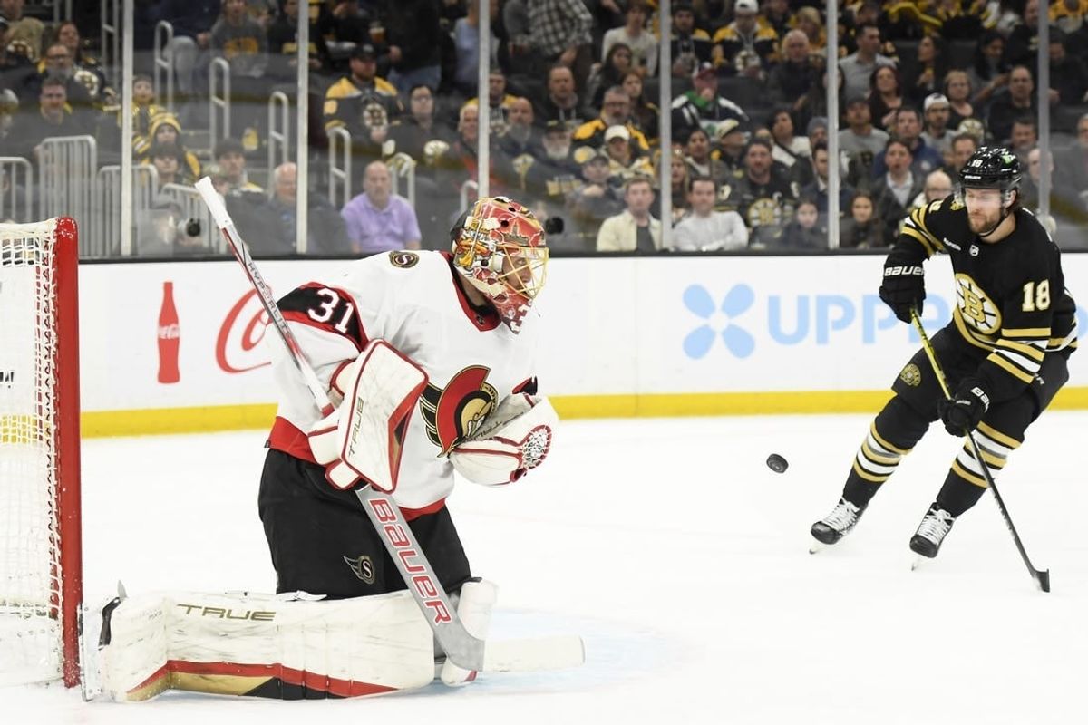 Apr 16, 2024; Boston, Massachusetts, USA;  Ottawa Senators goaltender Anton Forsberg (31) makes a save while Boston Bruins center Pavel Zacha (18) looks for the rebound during the first period at TD Garden.