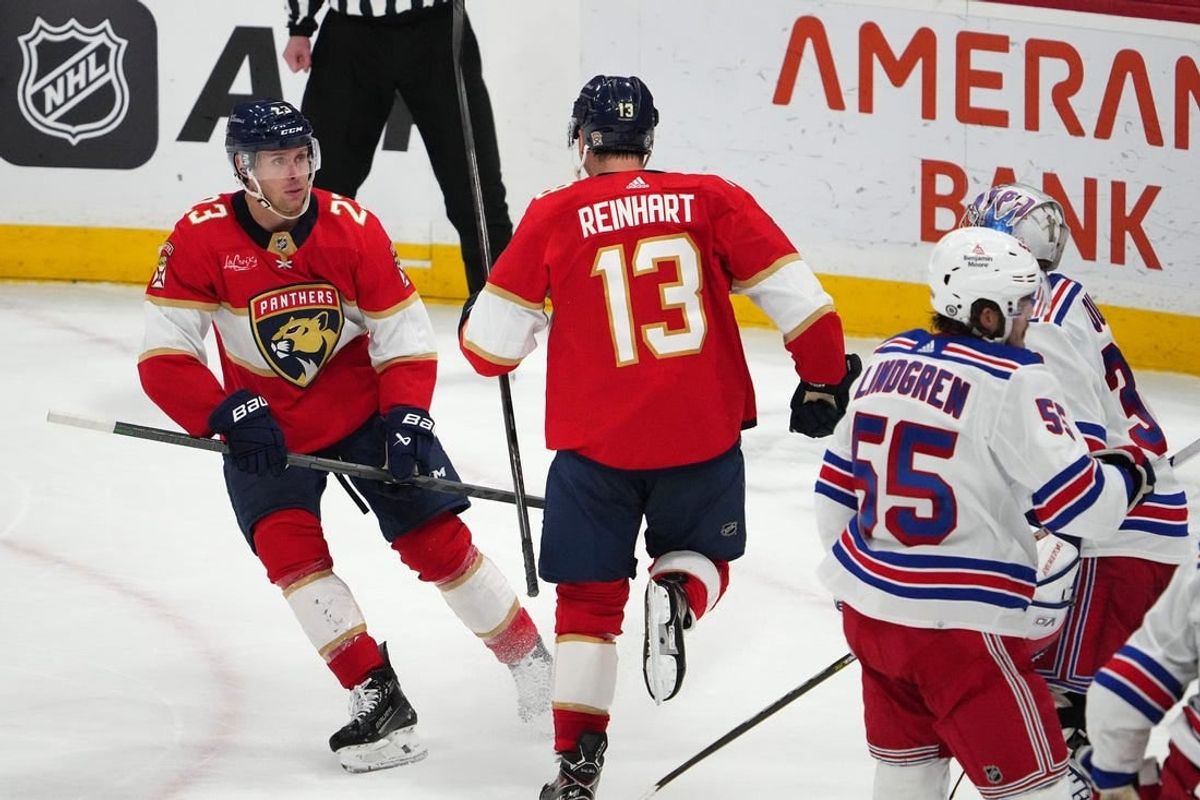 Dec 29, 2023; Sunrise, Florida, USA; Florida Panthers center Sam Reinhart (13) celebrates his goal against the New York Rangers with center Carter Verhaeghe (23) during the second period at Amerant Bank Arena.