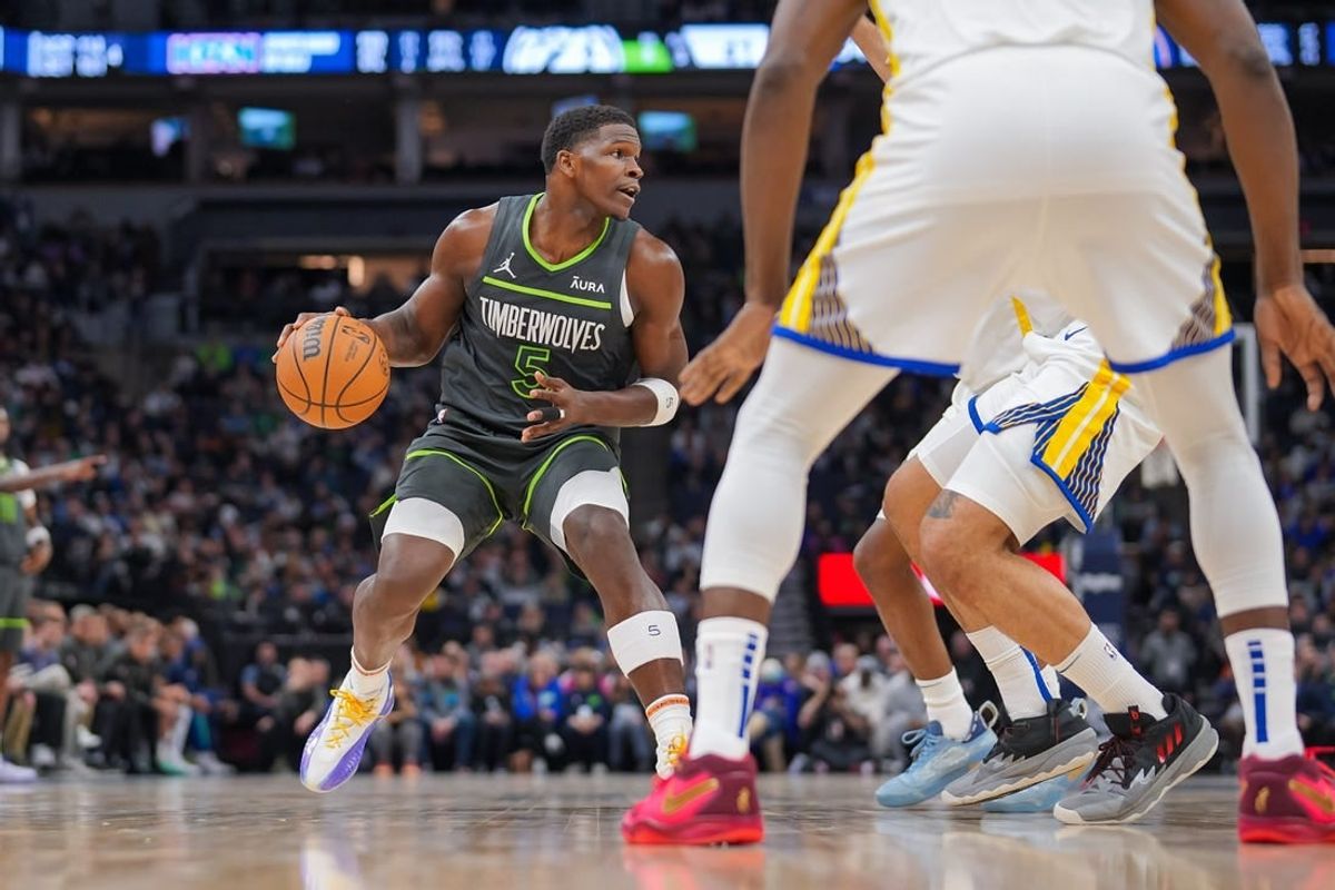 Mar 24, 2024; Minneapolis, Minnesota, USA; Minnesota Timberwolves guard Anthony Edwards (5) dribbles against the Golden State Warriors in the second quarter at Target Center.