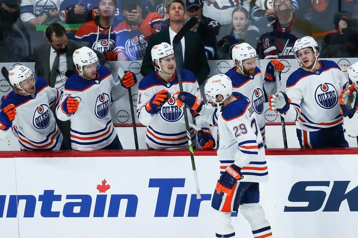 Nov 30, 2023; Winnipeg, Manitoba, CAN; Edmonton Oilers forward Leon Draisaitl (29) is congratulated by his team mates on his goal against the Winnipeg Jets during the third period at Canada Life Centre.
